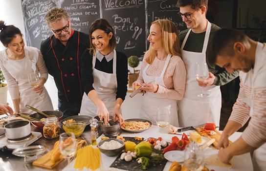 A group of people attending a cooking class. 