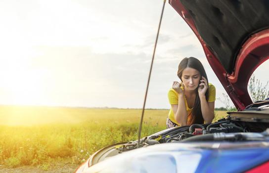 Frustrated motorist calling AAA Roadside Assistance, which provides towing, mobile battery service, gas, tires and more 24/7. 